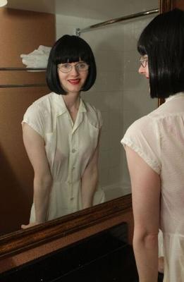 12P Stunning mature lady in glasses taking a bath in her clothes