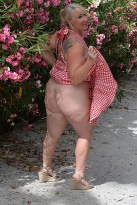 16P Fat mature blonde Melody plays with her huge boobs in a rose garden