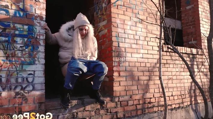 15P Blonde girl Masha Sweet takes a piss in an abandoned building on a cold day
