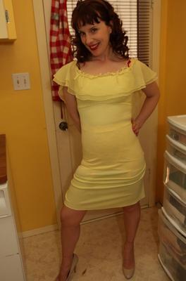 12P Older woman Dirty Angie strips to 3 piece retro lingerie in high heeled shoes