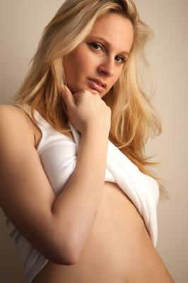 12P Natural blond with a pretty face flaunts her twat as she goes about bottomless