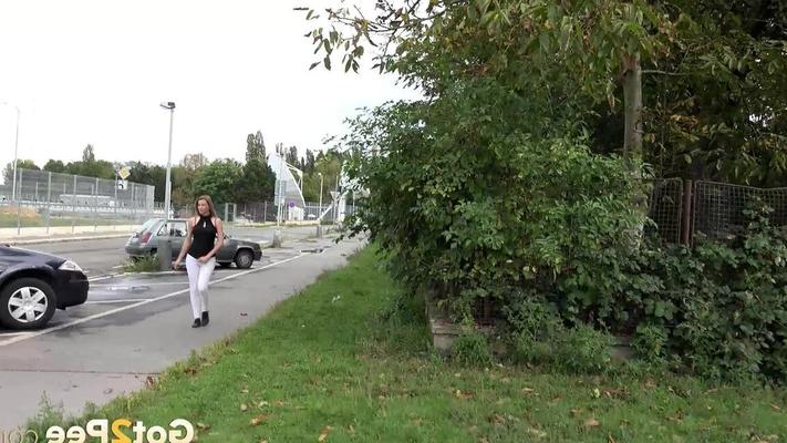15P Distressed female pulls down her pants and squats for a pee behind some trees