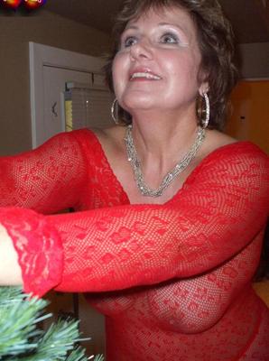 20P Mature lady Busty Bliss exposes her breasts during a Christmas celebration