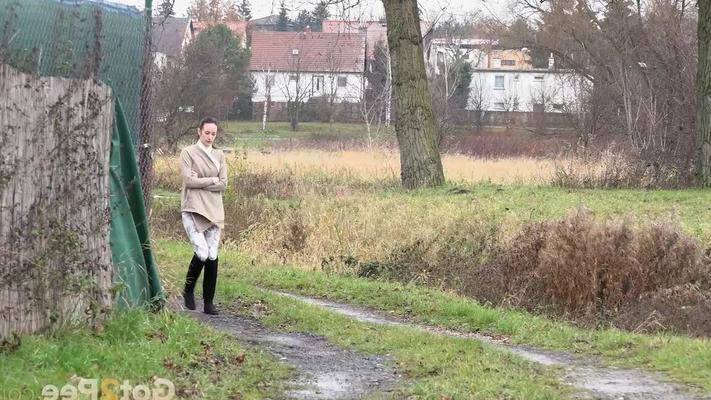 15P Wait girl Eveline Neill squats for a piss while out for a walk on a wet path