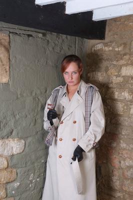15P Redhead woman Sammy frees her small tits from trench coat in leather gloves
