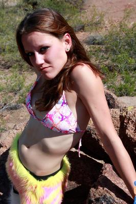 15P Thin girl Vixen wears furry OTK leggings while riding a huge dildo outside
