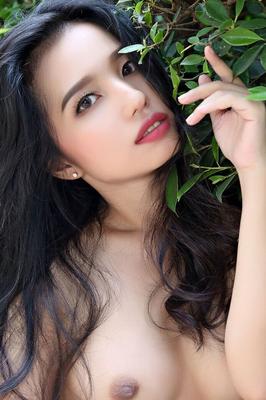 16P Beautiful Asian girl Norah gets totally naked next to a hedge in a garden