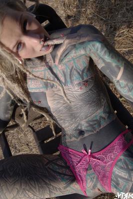 11P Totally tattooed girl Anuskatzz sucks on a dildo while touching her pussy