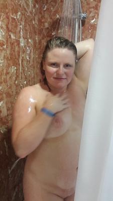 16P Amateur chick flashes her tits in public before taking a shower at home