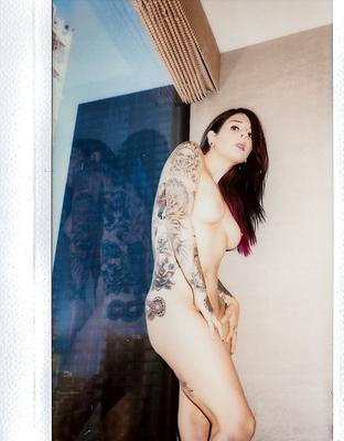 16P Amateur model Joanna Angel showing off her tattoo sleeve and bald pussy