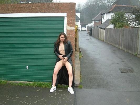 12P UK redhead flashes her naked body on the street in a long leather coat