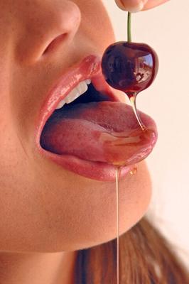 15P Pretty girl Sandra Shine curls her tongue while sucking juice from a cherry