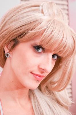 15P Platinum blonde chick Anya Wood models a skimpy bikini in heels