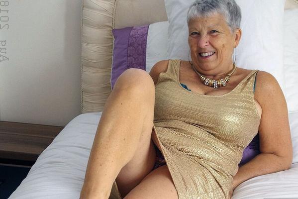 20P Hot granny Savana showcases her shaved pussy after a naughty striptease