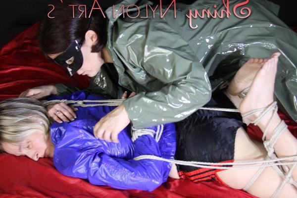 16P Watching sexy Sonja wearing a sexy shiny nylon shorts and a rain jacket being