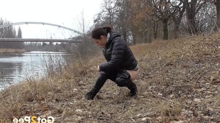 15P Antonia Sainz squats and pees near the river