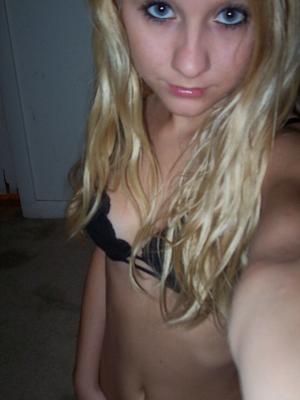 12P Teen strips out of her clothes to just her black lace bra and panties