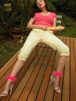 15P Mature lady Tasty Trixie flashes a whale tail while stripping to heels on deck