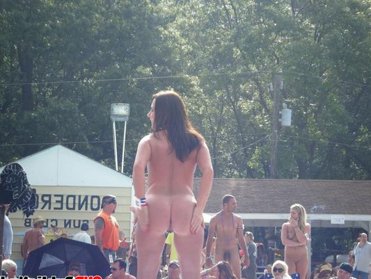 12P Stripper on outdoor stage shows her tight pussy to the crowd