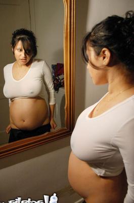 16P Talia 8 months pregnant posing in the mirror