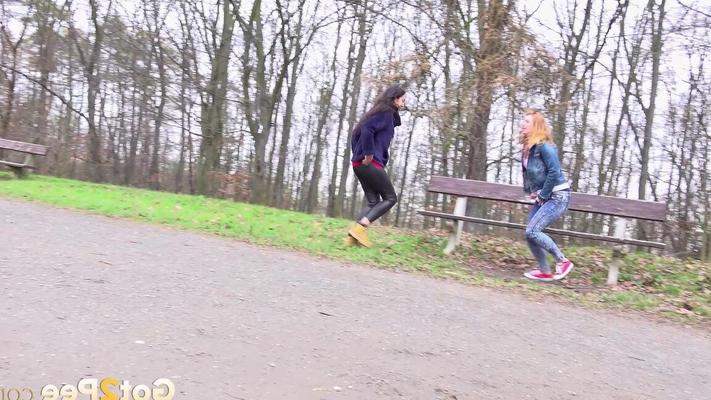 15P Best friends Esperansa & Chrissy Fox squat to pee near a bench in a park