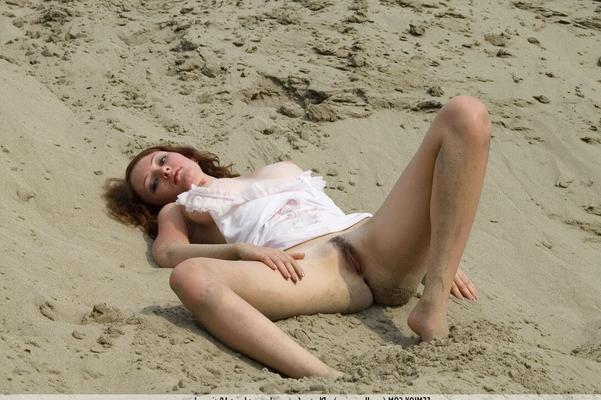 16P Glamor model Camila gets completely naked on sandy slope by herself