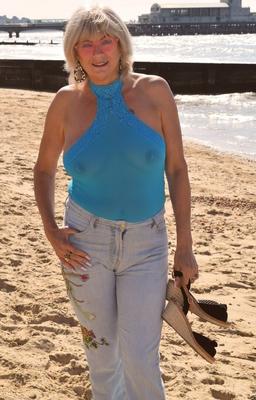 16P Mature blonde woman shows her tits and pussy after eating an ice cream treat