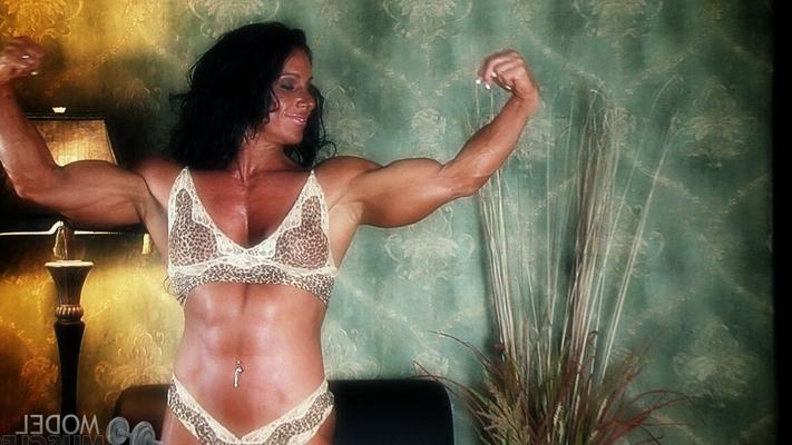 21P Sexy bodybuilder Debbie Bramwell teases with her muscles and pierced belly