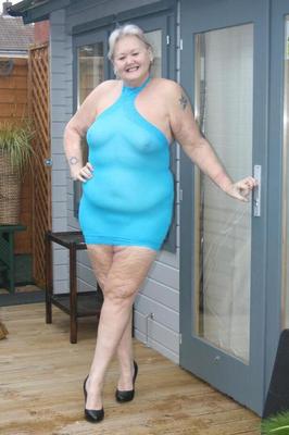 20P Fat granny hikes up see thru dress to expose her vagina in black pumps