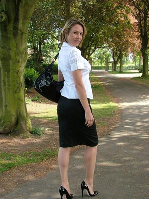 16P Fully clothed secretary Monica shows off hose clad legs in pumps on pathway