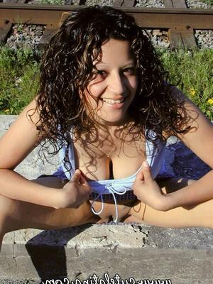 15P Latina amateur Talia exposes herself while walking railway tracks in the city