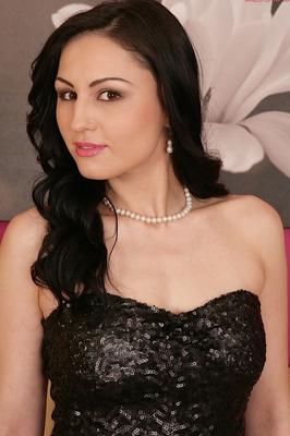 15P Dark haired girl Kirschley Swoon removes a black dress before toying her twat