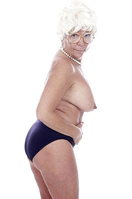 16P Granny pornstar Karen Summer modelling fully clothed before stripping naked