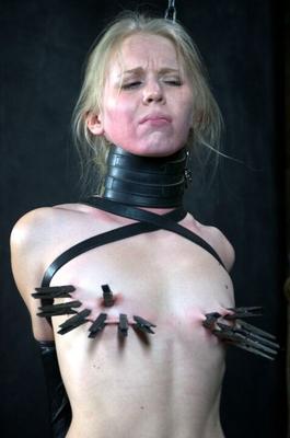 16P Blonde chick Sarah Jane Ceylon is restrained in a variety of ways in a dungeon