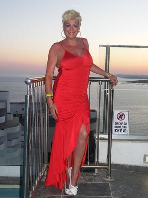 20P Older blonde Dimonty wears her hair short while showing her natural tits