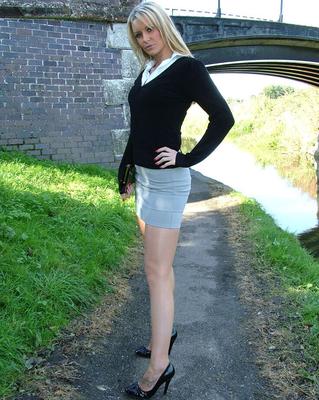 16P Non nude blonde shows off sexy legs in miniskirt and black pumps on foot path