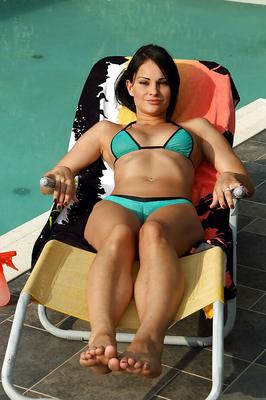 16P Graceful amateur brunette with sexy legs taking off her bikini outdoor