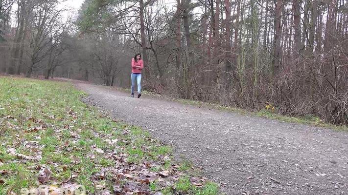 15P Tiny Tina squats on a wooden bench alongside a path for an urgent piss