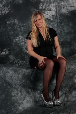 20P Aged blonde Sweet Susi looses her natural tits from a black dress in stockings