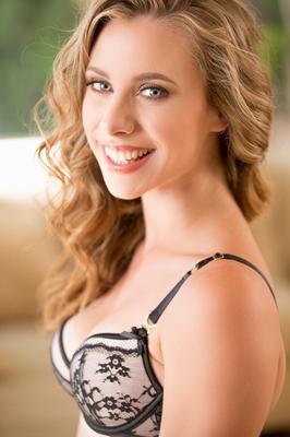 15P Natural blonde Anya Olsen peels off her bra and thong in a sexy fashion
