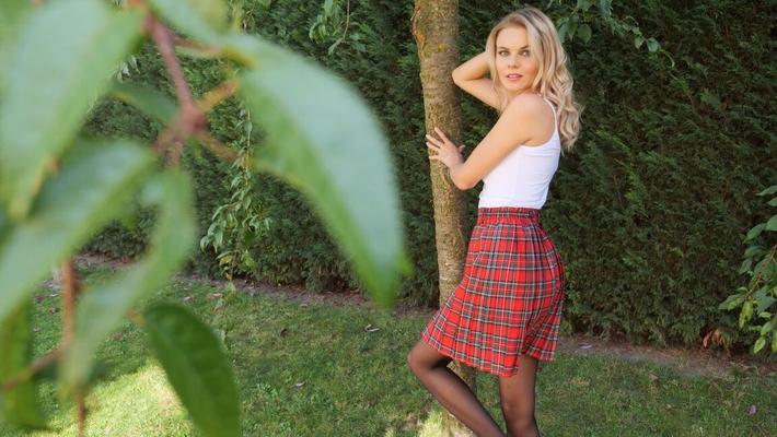 11P Barely legal blonde Kate Jones shows her small tits and tight ass on a lawn