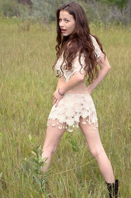 16P Skinny young girl Iva Nora teases her long hair in a field