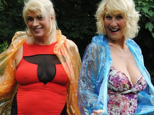 17P Mature lesbian Dimonty and GF cover their naked bodies in see thru raincoats