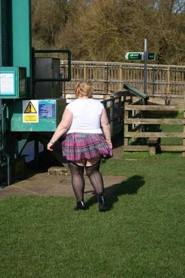 19P Obese blonde Lexie Cummings sports a butt plug while pissing in a parking lot