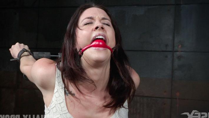 15P Brunette female Chanel Preston undergoes a throat fuck in a dungeon