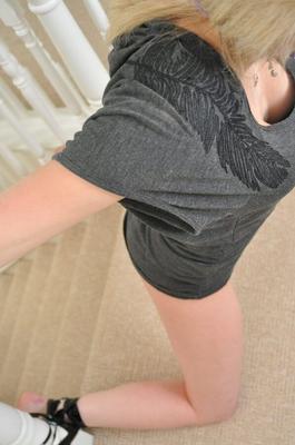 12P Blonde girl sports a ball gag while restrained to a bannister