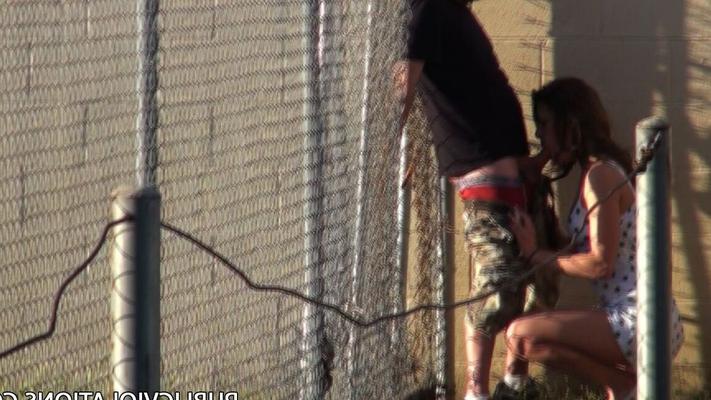 20P Horny slut gives a public blowjob & gets nailed up against the prison fence