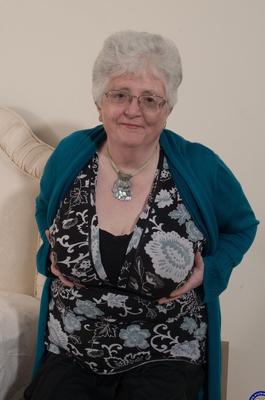 21P Kinky granny Caroline V fondles her big breasts & toys her fat pussy on a bed