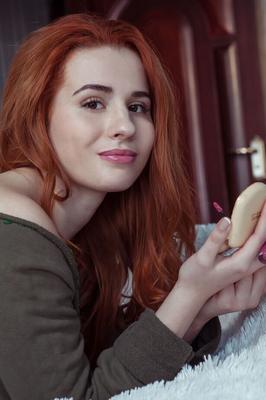 18P Young redhead Nicole La Cray highlights her perfect pussy while getting naked