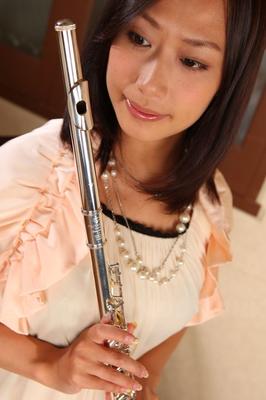 15P Charming Japanese MILF Yayoi Yanagida posing with a flute in sexy outfit